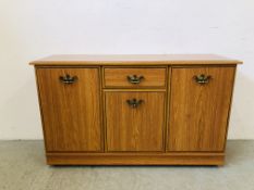 A MODERN 3 DOOR 1 DRAWER SIDEBOARD - 125CM W X 40CM D X 74CM H.