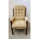 AN OATMEAL UPHOLSTERED ARM CHAIR.