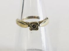 A 9CT GOLD DIAMOND SOLITAIRE.