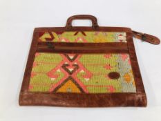 A VINTAGE "KILIM" LEATHER CARPET BAG.