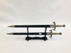 2 REPRODUCTION DISPLAY SWORDS WITH WALL MOUNTING BRACKETS.