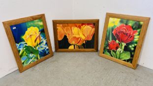 A GROUP OF THREE FRAMED FLOWER PRINTS, THE LARGEST 50CM X 70CM.