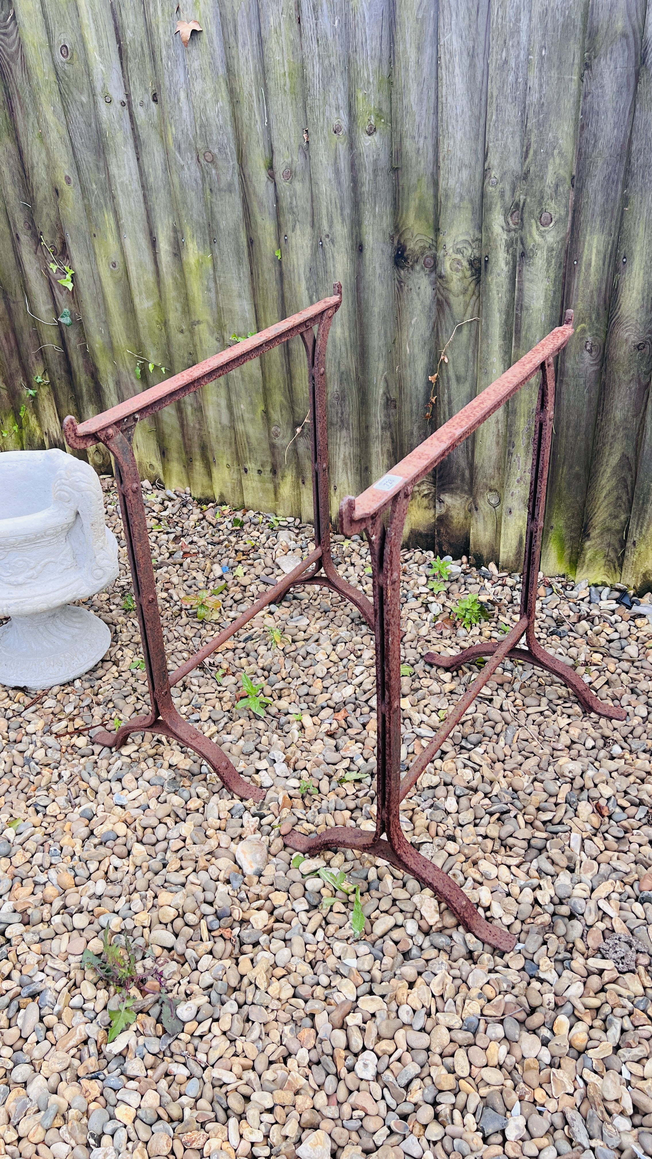 A PAIR OF VINTAGE WROUGHT METAL STANDS