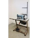 AN INDUSTRIAL SEWING MACHINE FITTED ON WORK TABLE WITH FOOT OPERATED SWITCH - TRADE SALE ONLY.