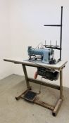 AN INDUSTRIAL SEWING MACHINE FITTED ON WORK TABLE WITH FOOT OPERATED SWITCH - TRADE SALE ONLY.