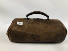 A VINTAGE BROWN LEATHER BAG MARKED FINNIGANS 16 BOND STREET MANCHESTER AND LIVERPOOL.