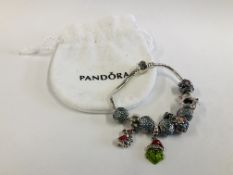 A MODERN BRACELET MARKED PANDORA CONTAINING 10 CHARMS.
