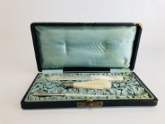 A CASED ANTIQUE MOTHER OF PEARL WRITING DESK SET COMPRISING OF LETTER OPENER, TWO CLIPS,