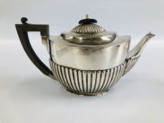 A SILVER TEAPOT OF OVAL HALF FLUTED FORM BY WILLIAM GIBSON AND JOHN LANGMAN, LONDON ASSAY 1894.