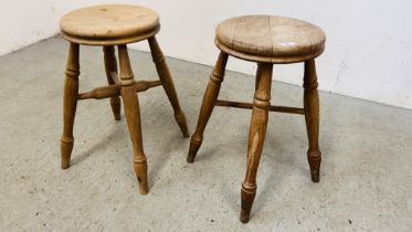 A PAIR OF VINTAGE SOLID BEECH STOOLS - HEIGHT 50CM.