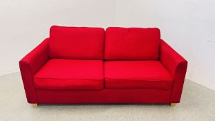 A MODERN RED UPHOLSTERED DOUBLE SOFA BED - LENGTH 180CM.