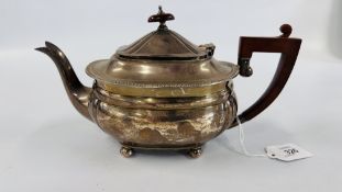 A SILVER TEAPOT,