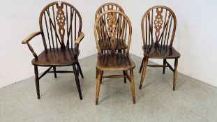 A GROUP OF 4 WHEEL BACK DINING CHAIRS INCLUDING 1 CARVER.