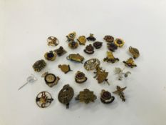 A BAG OF MIXED MILITARY ENAMELLED BADGES AND CAP BADGES.