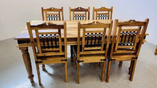 A MODERN HARDWOOD DINING TABLE WITH METAL BRACKET DETAILING COMPLETE WITH A SET OF SIX MATCHING