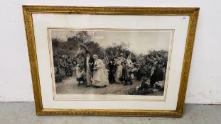 A LARGE FRAMED PRINT "THE VILLAGE WEDDING" LUKE FILDES IN IMPRESSIVE GILT FRAME, 68.5CM X 100CM.