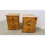 A PAIR OF HONEY PINE THREE DRAWER BEDSIDE CHESTS.