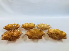 A GROUP OF 6 CARNIVAL GLASS FRILLED EDGED BOWLS TO INCLUDE GOOD LUCK DESIGN.