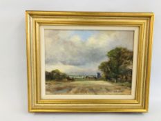 A GILT FRAMED OIL ON BOARD DEPICTING A RURAL CHURCH LANDSCAPE "REPPS NORFOLK" BEARING SIGNATURE