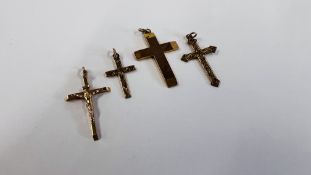 A GROUP OF FOUR 9CT GOLD CROSS PENDANTS.