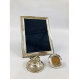 TWO SILVER PHOTO FRAMES AND A SILVER CAPSTAN INKWELL.
