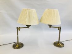 A PAIR OF MODERN BRUSHED BRASS ADJUSTABLE TABLE LAMPS WITH SHADES - SOLD AS SEEN.