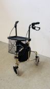 A CARE CO FOLDING 3 WHEEL WALKING AID IN BLACK AND GOLD FINISH WITH FRONT BASKET AND CANVAS BAG.