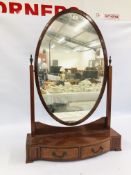 AN IMPRESSIVE EDWARDIAN OVAL DRESSING TABLE MIRROR ON A TWO DRAWER STAND, H 112CM X W 74.