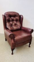 A GOOD QUALITY TAN LEATHER BUTTON BACK WING CHAIR.