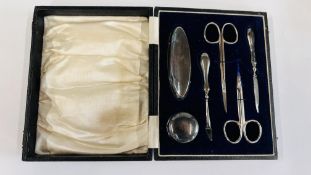 A CASED SILVER MANICURE SET MARKED G & CLO BIRMINGHAM ASSAY.