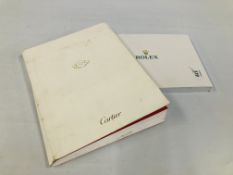 A ROLEX 2013/14 SALES CATALOGUE WITH PRICE LIST ALONG WITH 150 YEARS OF CARTIER LIMITED EDITIONS.