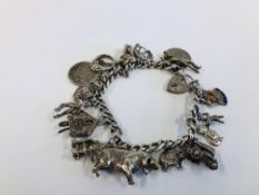 VINTAGE 925 SILVER GATE BRACELET WITH 17 CHARMS ATTACHED.