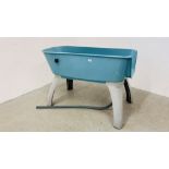 A PLASTIC BOOSTER BATH DOG BATH