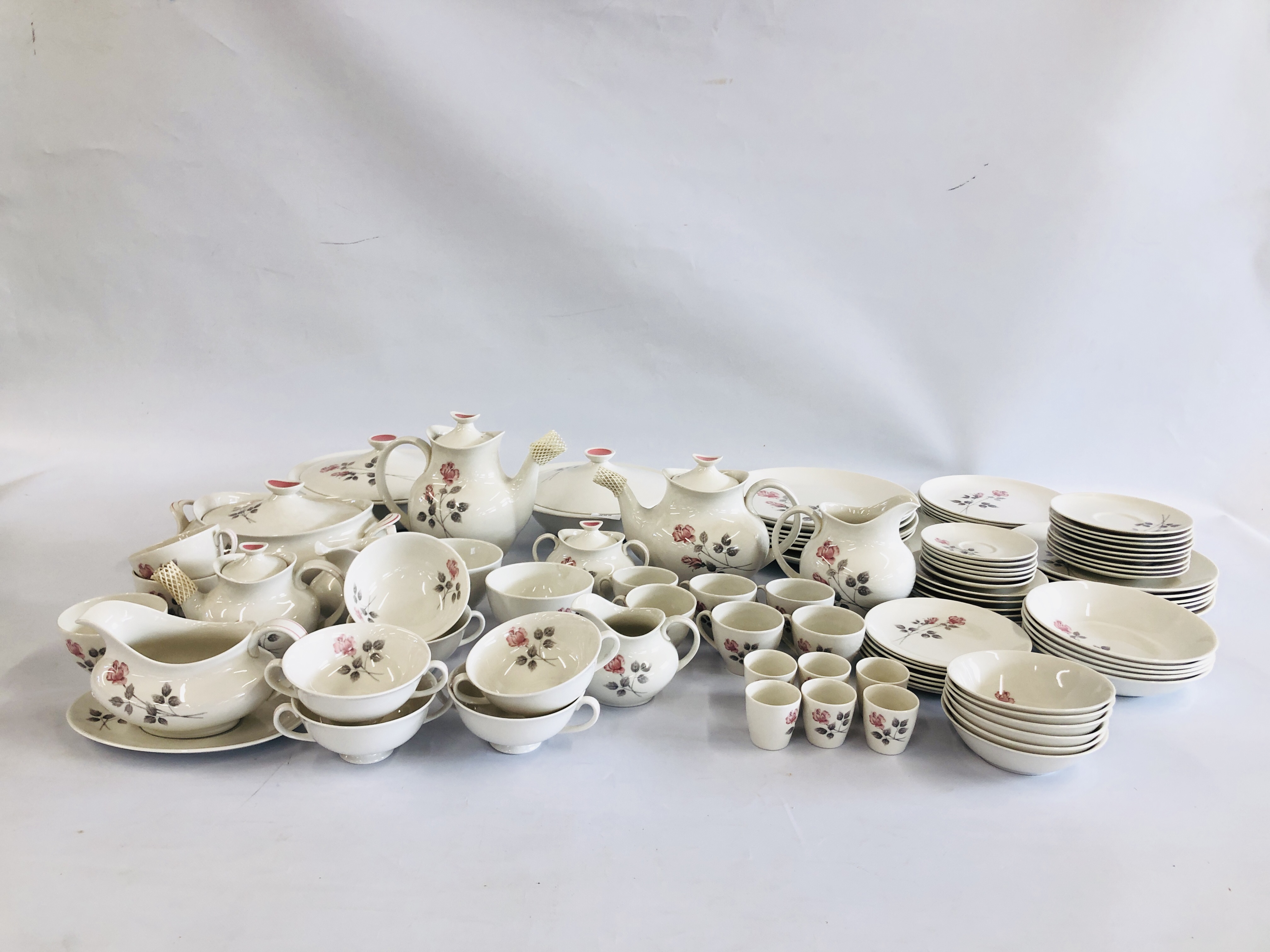 APPROXIMATELY 95 PIECES OF ROYAL DOULTON ENGLISH TRANSLUCENT CHINA "PILLAR ROSE" TEA AND DINNERWARE.