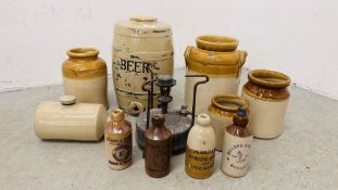 A GROUP OF VINTAGE STONEWARE STORAGE JARS AND BOTTLES TO INCLUDE LOCAL INTEREST AD A STONEWARE BEER