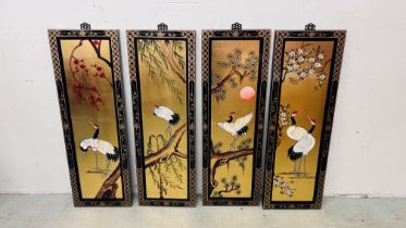A LACQUERED FOUR PANEL WALL HANGING DECORATED WITH STORKS (EACH PANEL W 31CM H 92CM)