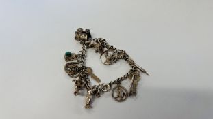 VINTAGE 925 SILVER BRACELET WITH 13 CHARMS ATTACHED.