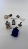 A COLLECTION OF 6 VINTAGE MINIATURE SCENT BOTTLES TO INCLUDE GLASS AND SILVER EXAMPLES.