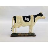 A VINTAGE CAST DOORSTOP IN THE FORM OF A COW.