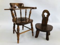 A VINTAGE CHILD'S COMMODE CHAIR ALONG WITH AN OAK CHILD'S CHAIR WITH CARVED BACK.