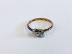 A THREE STONE DIAMOND RING THE SHANK MARKED 18CT PLAT.