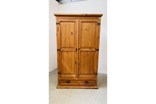 A WAXED PINE TWO DOOR WARDROBE WITH SINGLE DRAWER BASE - W 116CM X D 60CM X H 195CM. - Image 1 of 9