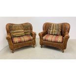 A PAIR OF MODERN WICKER CONSERVATORY ARMCHAIRS WITH UPHOLSTERED STRIPED SEAT CUSHIONS.