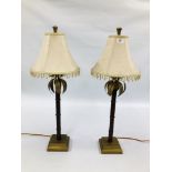 A PAIR OF DESIGNER METAL WORK LAMPS WITH BEADED FRINGED SHADES H 75CM - SOLD AS SEEN.