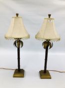 A PAIR OF DESIGNER METAL WORK LAMPS WITH BEADED FRINGED SHADES H 75CM - SOLD AS SEEN.