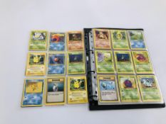 A BINDER CONTAINING APPROX 270 POKEMON TRADING CARDS.