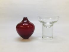 A DESIGNER RUBY RED VASE MARKED MURANO WITH A CLEAR GLASS VASE.