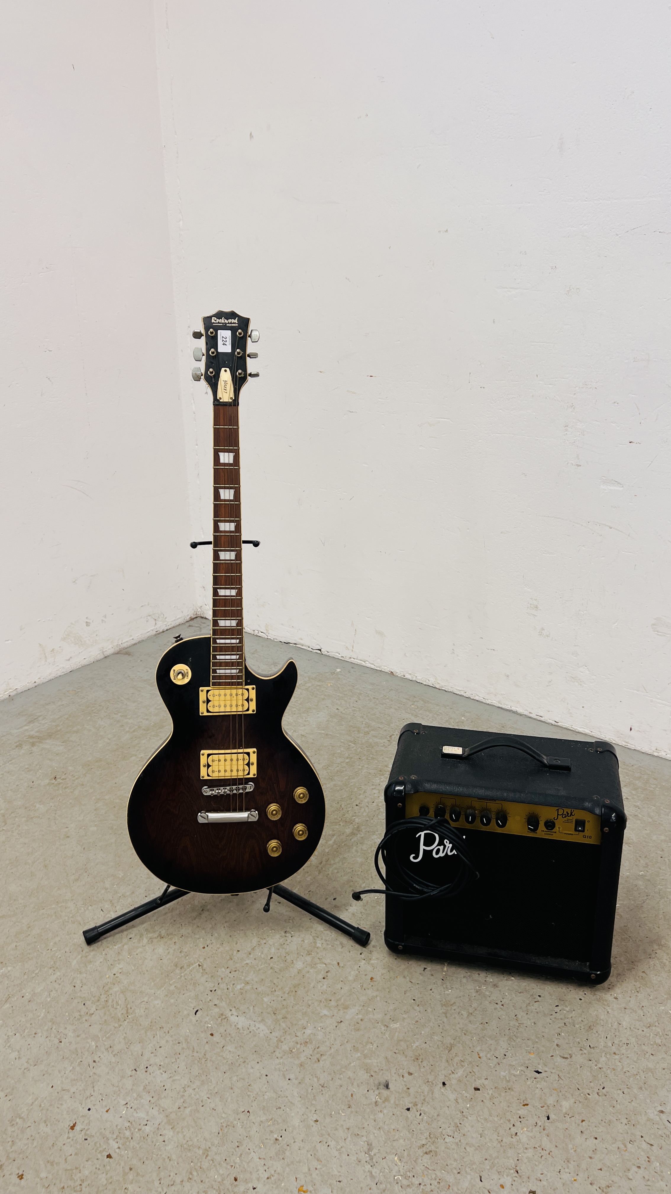 A ROCKWOOD BY HOHNER "LX25OG" ALONG WITH PARK MODEL G10 AMPLIFIER AND DIXON STAND - SOLD AS SEEN.