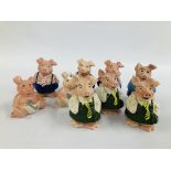 A GROUP OF 9 WADE NATWEST COLLECTORS PIGGY BANKS.