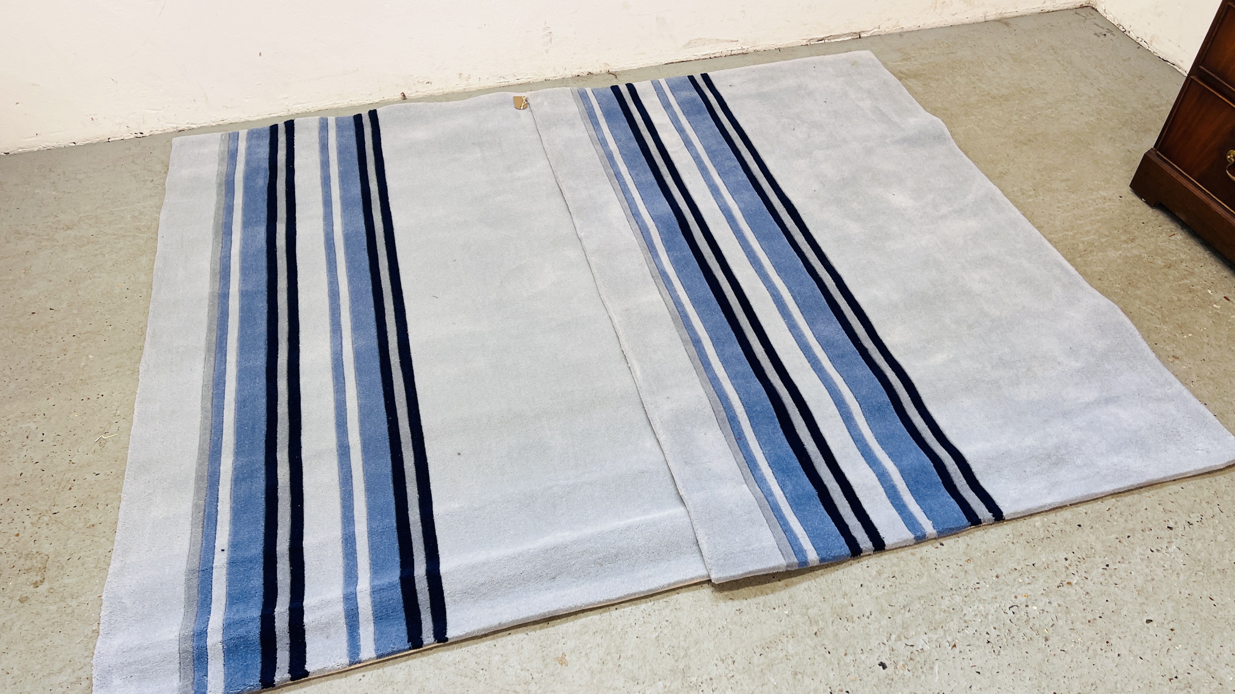 TWO APOLLO HANDMADE BLUE RUGS, 108CM X 167CM.